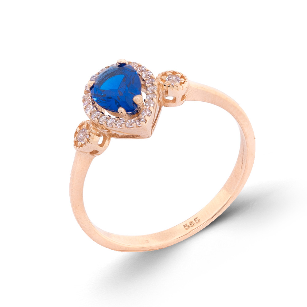 Damenring aus 585 Rotgold mit blauem Saphir und farblosen Zirkonia